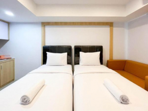 Homey and Cozy Studio at De Prima Apartment By Travelio